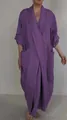 Full-length front view of a purple linen maxi dress featuring a V-neck and large side pockets. - Purple