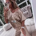 Close-up of stylish beige lounge set featuring a sequined evil eye graphic. - S / Top And Bottom / Khaki