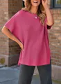 Close-up of a loose-fit rose red knitted T-shirt featuring a ribbed texture and drop shoulders. - S / Tops / Rose Red
