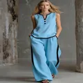 Elegante completo azzurro senza maniche con scollo a V e pantaloni larghi con bordo nero - Taglia S / Top E Pantaloni / Celeste