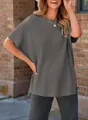 Close-up view of a women's casual grey ribbed knit sweater featuring a loose oversized fit - Dark Gray
