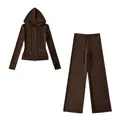 Macro detail of the brown thermal yoga set featuring zip-up hoodie and wide-leg pants - Coffee Set