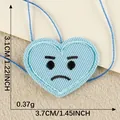 Light blue heart-shaped embroidery patch with grumpy face expression for DIY decor - Blue Pouty Quirky Heart (14)