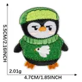 Cute cartoon penguin embroidered patch wearing green sweater and hat, 5.5x4.7cm size - Self-Adhesive (5.5x4.7cm)