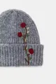 Close-up macro shot of the detailed red rose floral embroidery on grey knitted beanie - Embroidered Hat