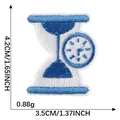Blue and white embroidered hourglass and clock patch with dimension markings, 3.5x4.2cm - Hourglass Pattern