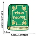 Green cartoon book embroidered patch with 'than people' text, dimensions 5.5x4.3cm - Green Book (than people)