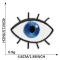 Blue embroidered eye patch iron-on DIY clothing decoration measuring 4.8cm by 4cm - Eye