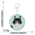 Bestickter schwarz-weißer Katzen-Schlüsselanhänger mit Sternverschluss, 5,8 cm. - Tuxedo Katze Stil / 1 Stück