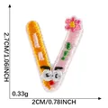Embroidered letter V patch with floral detail and cartoon face for clothing - Letter V (2026.5.27)