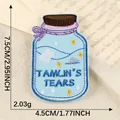 Geborduurde patch in de vorm van een fles met Tamlin's Tears tekst, wolken en sterren - 7.5x4.5cm