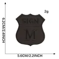 Parche bordado negro en forma de escudo con letra M y SIGN, tamaño 6,2x5,6 cm - Parche Bordado de Escudo (SIGN M) / 6.2cmx5.6cm / Negro