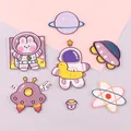 Collection of cute cartoon astronaut and planet themed embroidered iron-on patches. - 6-Piece Set