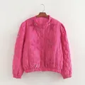 Detailed view of pink quilted jacket with velvet floral appliques and lantern sleeves. - S / Tops / Rose Red