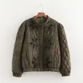Detailed macro view of dark green quilted jacket featuring elegant floral velvet appliqués - S / Tops / Army Green