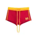 Dettaglio di pantaloncini rossi American vintage con coulisse gialla e stampa 06 - Taglia S / Pantaloni e gonne / Rosso