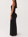 Perfil lateral de un vestido largo de punto negro ajustado con elegante abertura en la espalda. - XXS / Top Y Pantalón / Negro