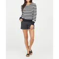 Casual women's elastic twill canvas shorts styled with a striped sweater and sandals - Black
