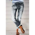 Macro view of washed grey slim fit denim pants for women with trendy distress details - XS / Bottoms / Gray