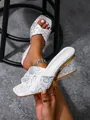Detailed macro view of stylish snake pattern wedge sandals featuring a square toe design - 38 / White Snakeskin