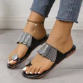 Close-up of black women's slide sandals with sparkling rhinestone toe loop and band - 36 / Black