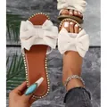 Elegant beige flat slide sandals with large bow and rhinestone trim for women's summer wear. - 36 / Beige
