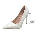 Detailed view of 10cm heel on white patent leather pointed toe stiletto pumps - White