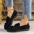 Casual black suede-like women's loafers with elegant gold-tone metallic hardware charms - 36 / Black