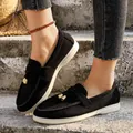 Black suede slip-on loafers for women with decorative gold bell charms - 38 / Black and White