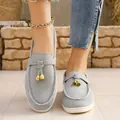 Stylish gray suede slip-on loafers for women featuring elegant golden tassel details - Gray