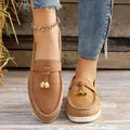 Women's brown suede slip-on loafers with decorative gold charms and white soles - Brown