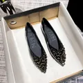 Elegante schwarze flache Schuhe mit spitzer Zehenpartie und Goldpailletten-Verzierung - 34 / Schwarz