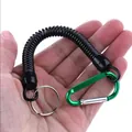 Detail of elastic coiled fishing lanyard with green carabiner and split ring. - Green