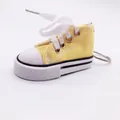 Yellow miniature sneaker keychain and kickstand cover accessory - Yellow