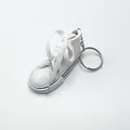 Mini white canvas sneaker keychain and motorcycle kickstand cover decorative accessory - White