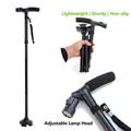 Dettaglio luce LED regolabile su bastone pieghevole per anziani con base - Nero
