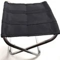 Top-down view of a black portable folding camping stool with aluminum alloy frame structure. - Silver