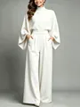 Close-up of elegant cream high-neck two-piece set with cape sleeves and wide-leg pants - S / Top And Bottom / White