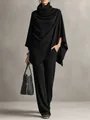 Detail view of a stylish black knit two-piece set with poncho top and wide leg pants. - S / Top And Bottom / Black