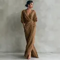 Elegant brown V-neck maxi dress with ruched waist detail shown on a professional fashion model. - XS / Dresses / Camel