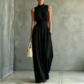 Elegante tuta nera senza maniche con collo alto e gamba larga per uno stile estivo - Taglia S / Vestiti / Nero