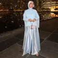 Elegant light blue long skirt set with hijab shown in a luxury night city setting. - XS / Set (YM01085) / Light Blue