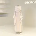 Elegant cream pleated maxi dress featuring long bell sleeves and a draped pleated bodice - Apricot