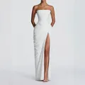 Full shot of white strapless dress featuring draped pleats and a high leg slit detail - White