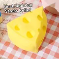 Detailed view of a realistic yellow cheese-shaped squishy toy for stress relief - Triangle Cheese (02) / 6x7x4cm