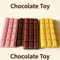Detailed view of chocolate-shaped slow rebound squishy toys in pink, brown and yellow - Triple Color Chocolate Style / Chocolate