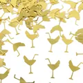 Detailed view of shiny gold metallic cocktail glass confetti for Hawaii theme party - Martini Glass / 15g Pack / Gold
