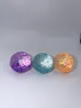 Close-up view showing three colorful sequin stress balls with a slow rebound texture. - Aurora Maltose 6cm