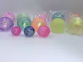 Glitter squeeze stress balls in various colors and sizes for sensory decompression play. - Aurora Maltose 4cm