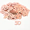 Detailed view of shiny rose gold number 50 metallic confetti for party table decor - 15g/Pack / Rose Gold